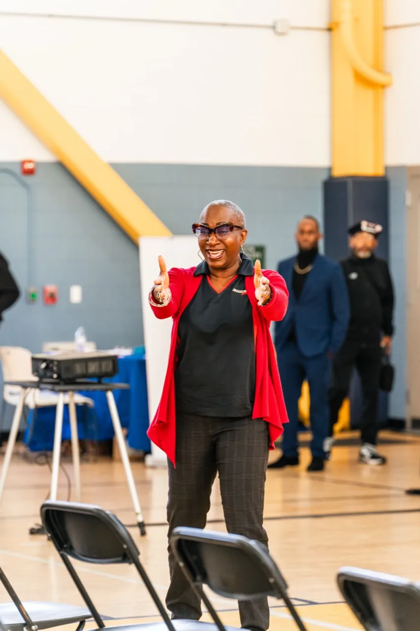 Presenter engaging attendees during a community workshop