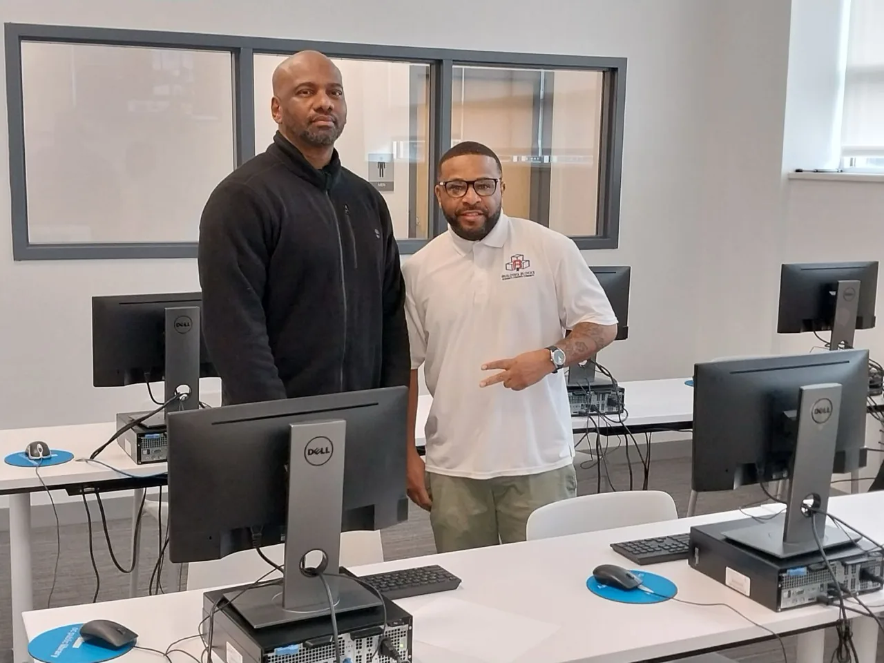 Community partners meeting in a computer training lab